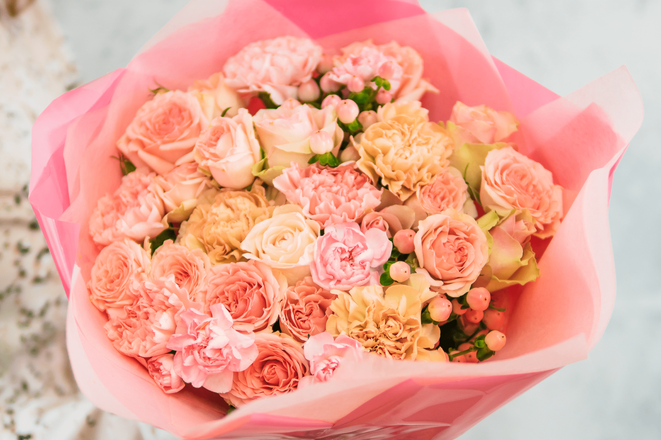 Bouquet of pink and peach flowers.