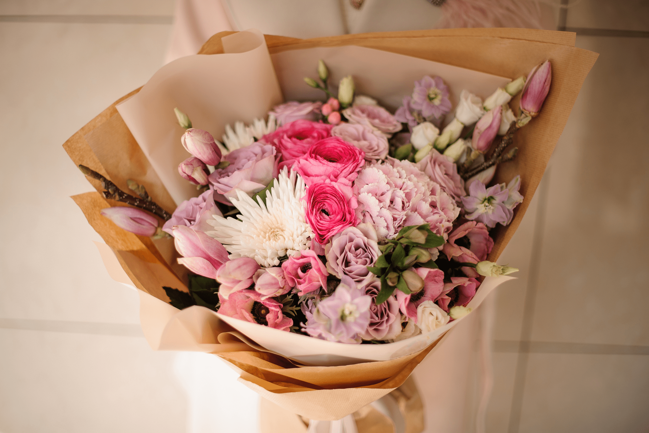 Bouquet of pink and white flowers wrapped.