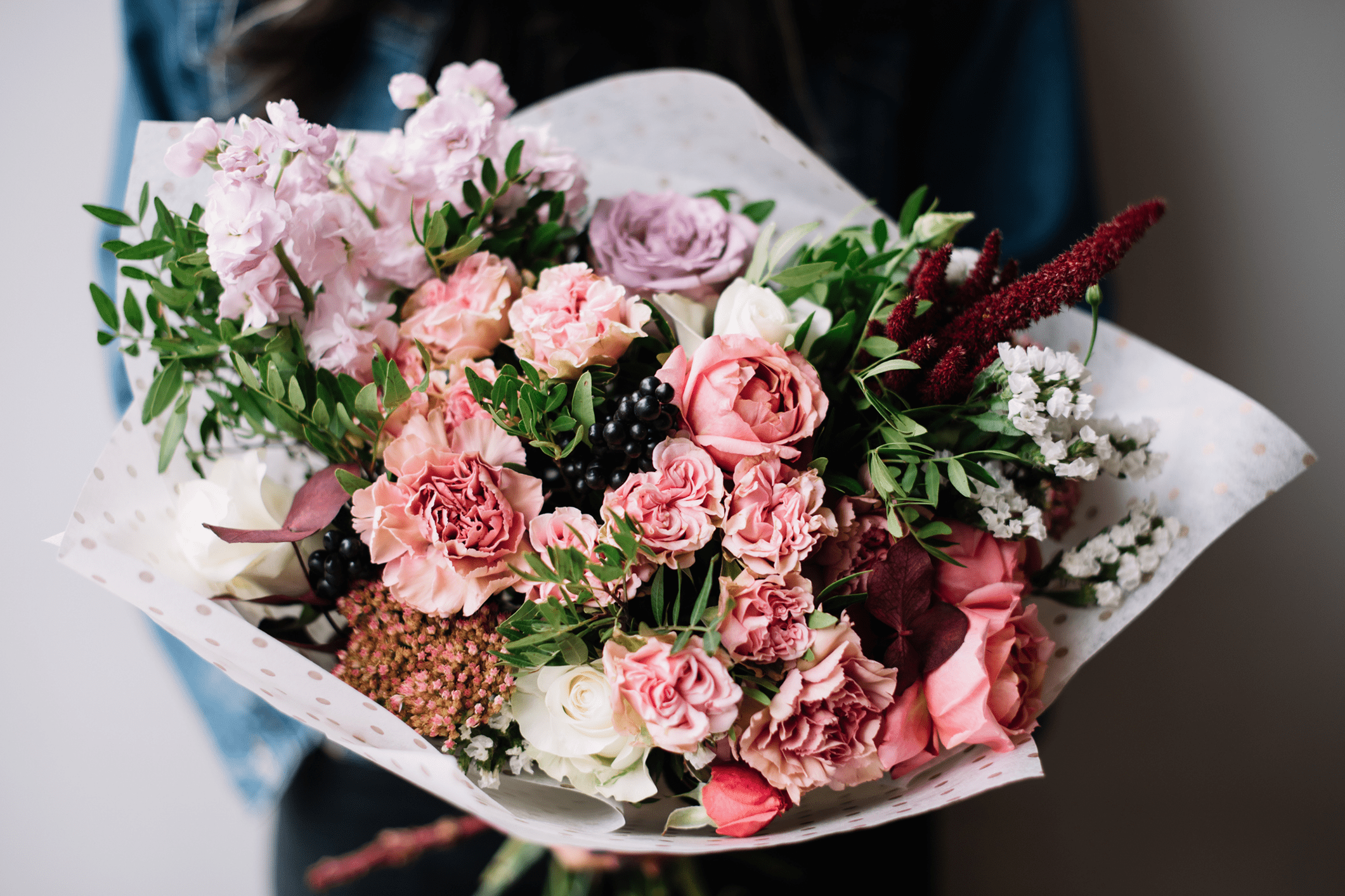 Bouquet of assorted colorful flowers and greenery.