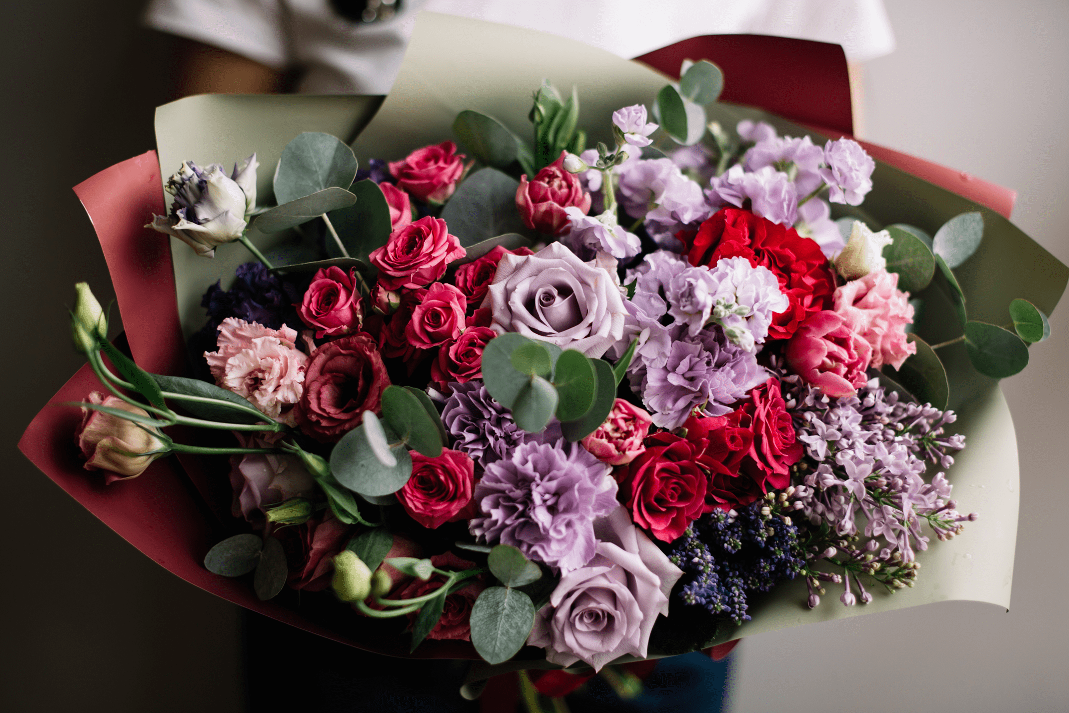 Colorful bouquet of mixed flowers and leaves.