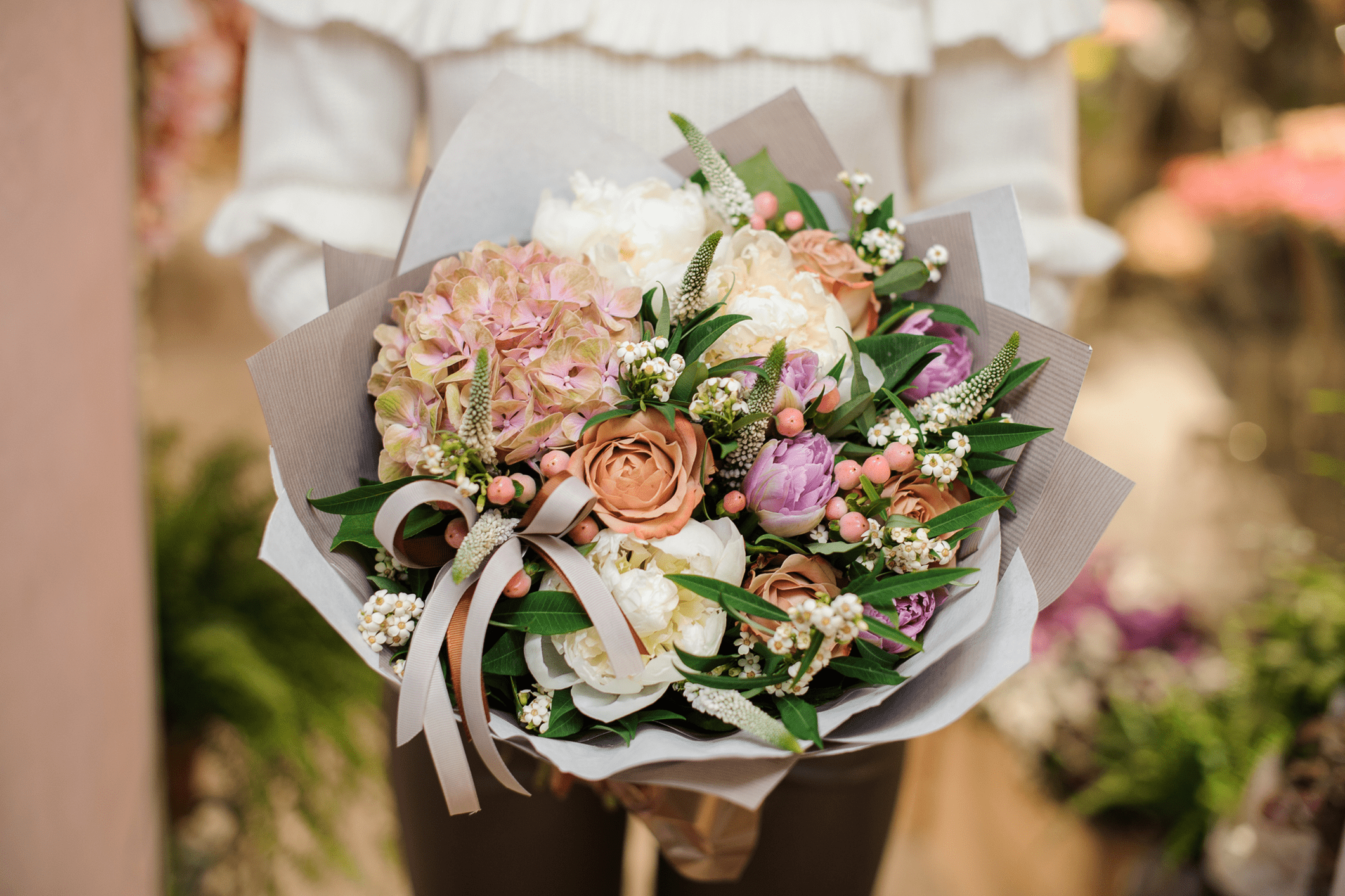 Bouquet of mixed flowers with greenery.