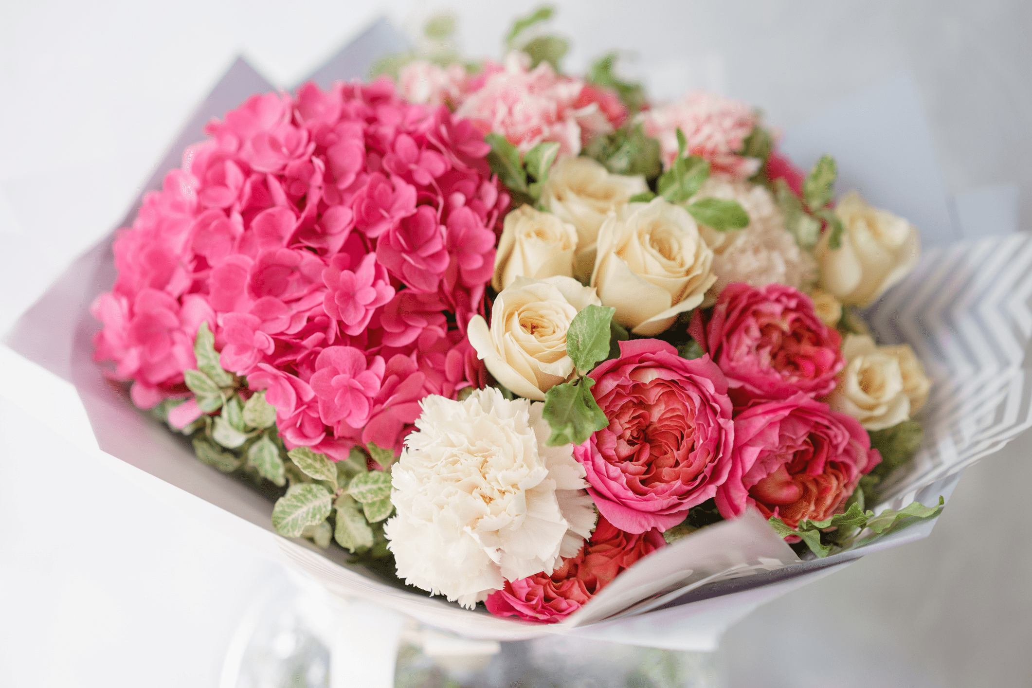 Bouquet of pink and cream flowers.